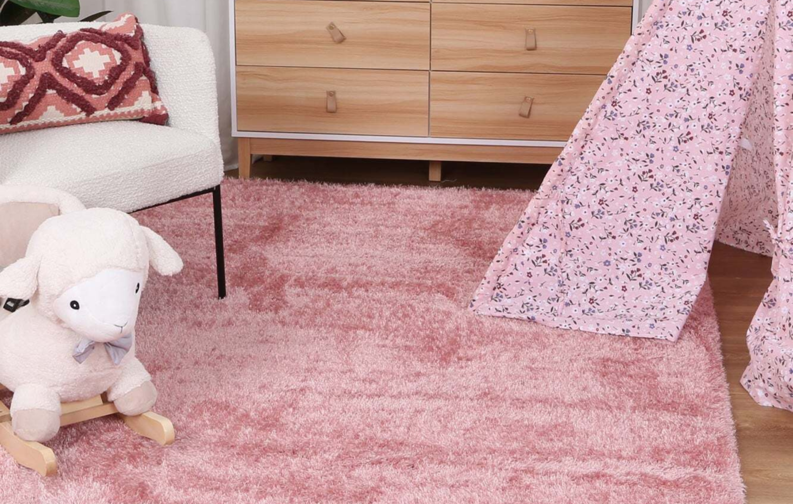 child's room with pink rug