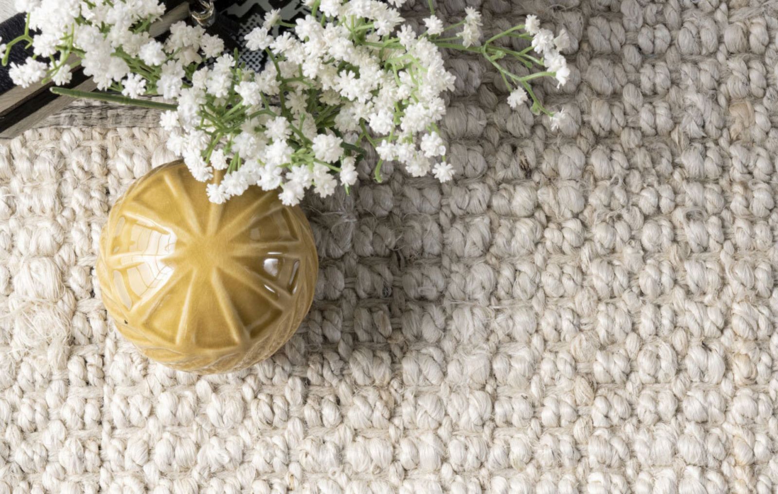 closeup of a jute rug with flowers